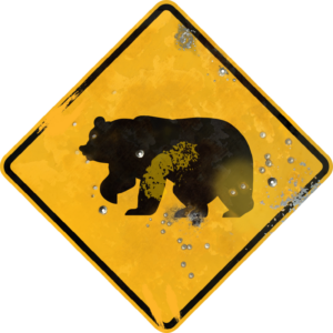 Street Sign with Bear Crossing Symbol. Vintage looking sign with digitally printed bullet holes.
