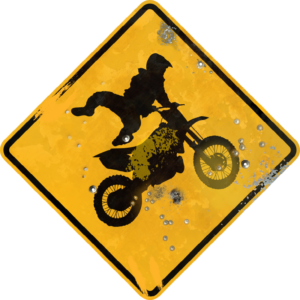 Street Sign motocross Symbol. Vintage looking sign with digitally printed bullet holes.