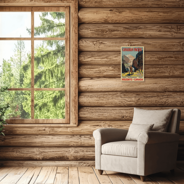 A cabin with a piece of wall art hung up on the wall above a chair.