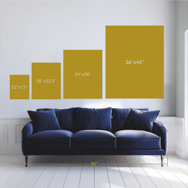 A photo of a couch with shapes on the wall depicting artwork scale.
